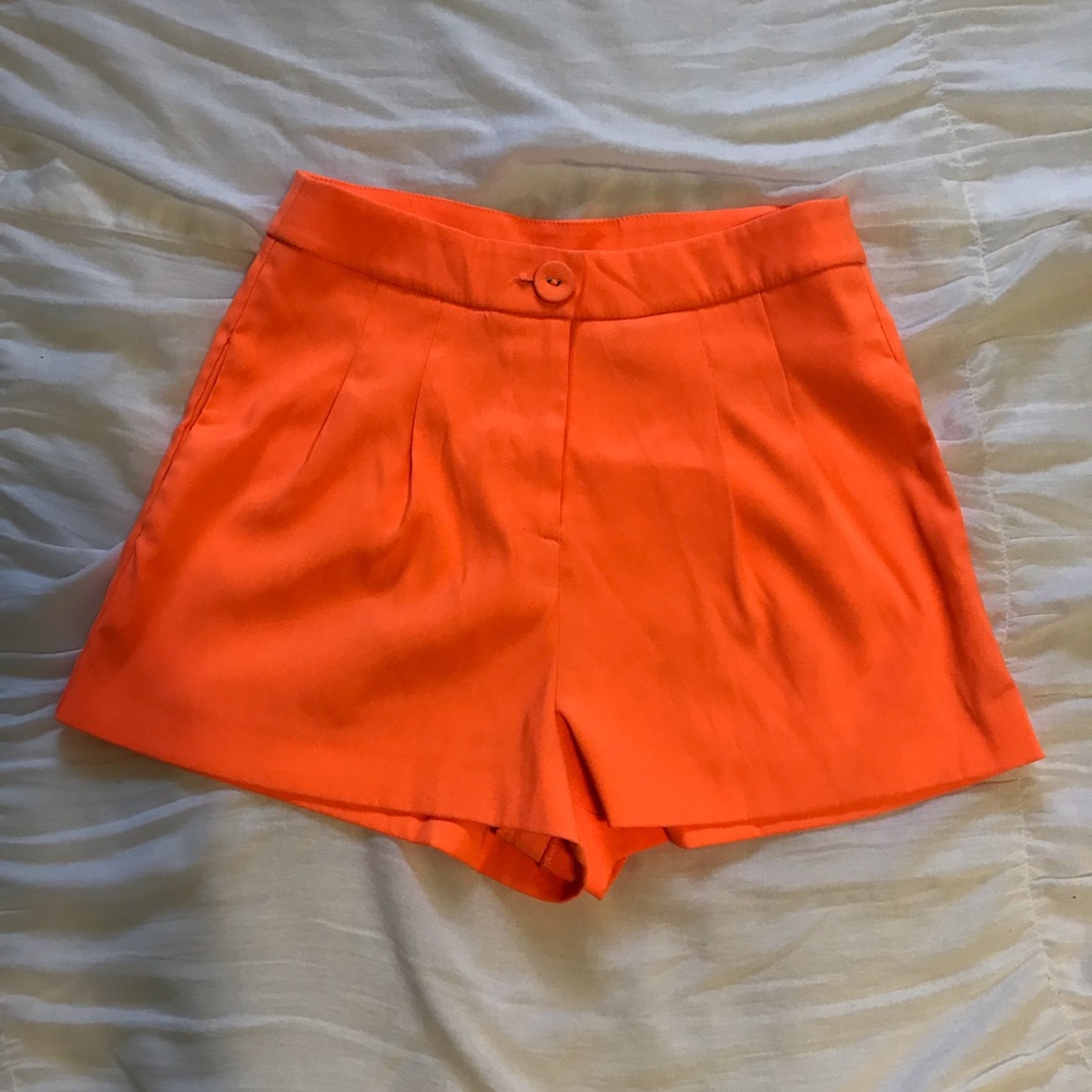 High waisted neon orange shorts
